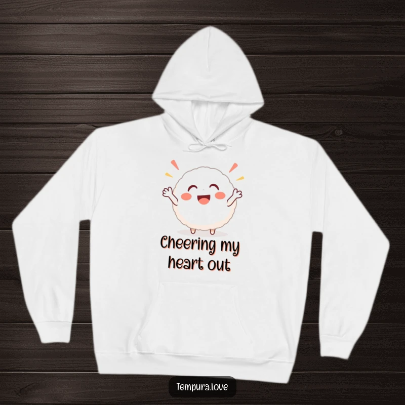 Funny rice ball hoodie featuring a jubilant, round character cheering heartily, offering warmth and a dose of pure joy.