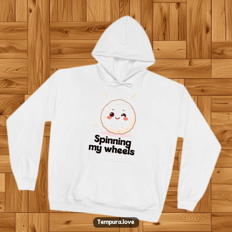 Funny hoodie featuring a smiling Japanese rice ball with happy eyes, happily spinning, perfect for cozy comfort.