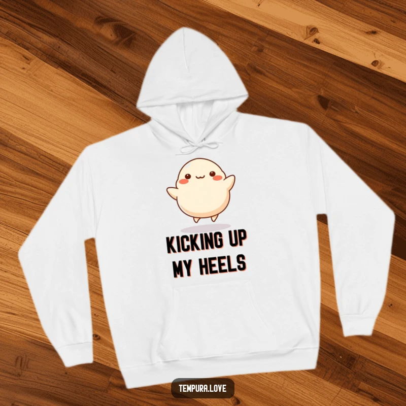 Funny Dumpling Hoodie illustrating a happy dumpling energetically kicking its legs, perfect for cozying up with a touch of food-themed humor.