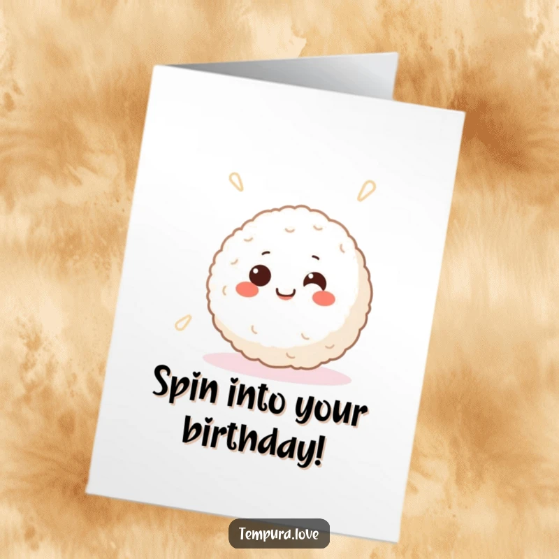 Funny Free Printable Birthday Card: A smiling Japanese rice ball with large happy eyes spins around joyfully.